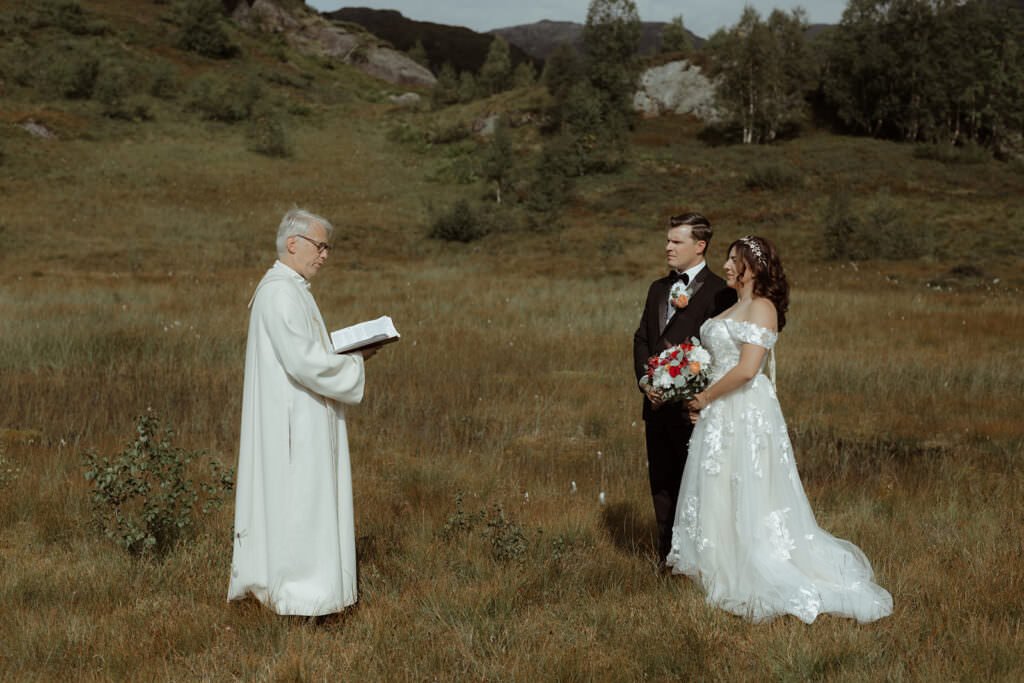 brides in the great outdoors in Norway experiencing their religious ceremony as a couple