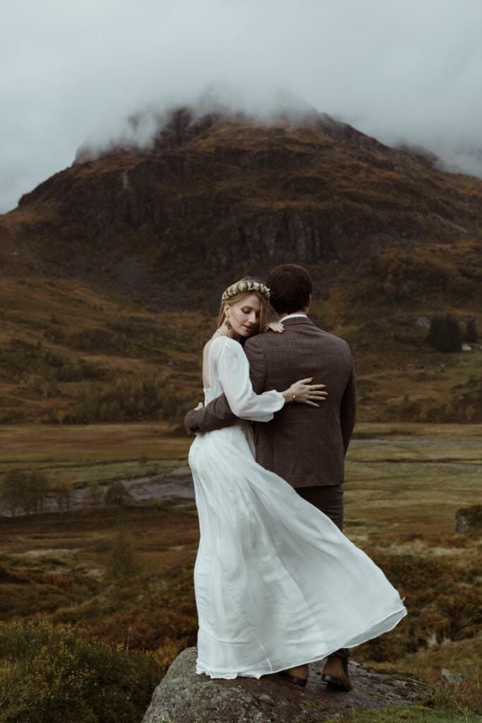 bride and groom in a norwegian landscape during autumn